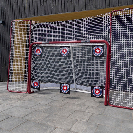 Hockey net with corner shooting targets set up outdoors for net-front tipping practice