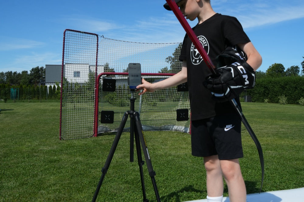 Phone with the XDT app on a tripod in front of the goal